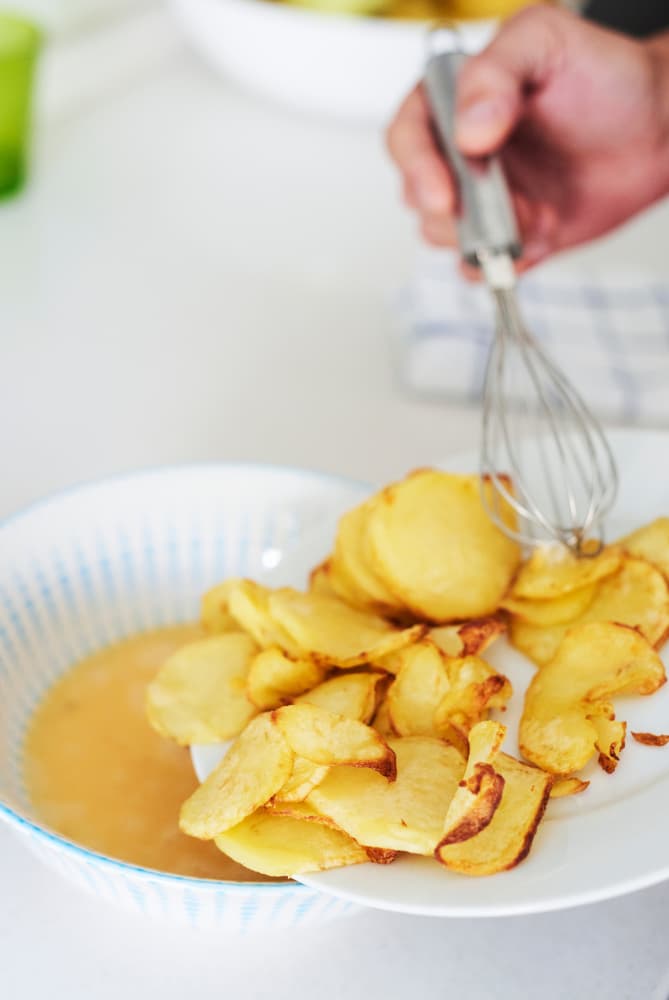 person preparing Spanish omelette